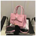 Sweet pink crossbody bag with large bow and heart crystal detail in textured PU leather - Pink