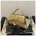 Metallic gold rectangle crossbody bag with silver crescent moon buckle and handle - Gold
