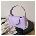 Detail showing lavender PU leather square bag with fashion text and sturdy handle - Purple
