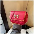 Quilted rose red crossbody bag with metal chain strap and bow knot decoration - Rose Red