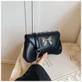 Minimalist black PU shoulder bag with golden butterfly buckle and chain strap - Black