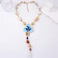Elegant Y-shaped beaded necklace featuring blue enamel flowers and baroque pearls - Necklace / Blue