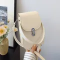 Minimalist beige crossbody cell phone bag with silver twist lock and smooth texture - White