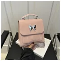 Pink niche butterfly backpack for women with ruffled texture and silver metallic charm - Pink