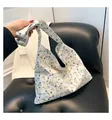 Off-white floral canvas tote bag with purple and green pansy pattern and knot handle - Off White