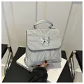 Silver wrinkled texture handbag with a liquid metal butterfly buckle for women - Gray