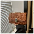 Brown quilted crossbody bag with gold chain strap and elegant metallic twist lock closure - Dark Brown