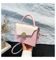 Pink and beige crossbody bag with gold pebble clasp and round handle detail - Pink