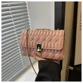 Elegant pink quilted crossbody bag with gold chain strap and black metal clasp - Pink