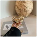 Mini gold lip-shaped metallic clutch bag with thin chain strap held by hand - Lip Shape (Model 2 Gold) / Gold