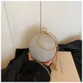 Mini silver spherical evening bag with sparkling metallic finish and gold rhinestone handle - Silver