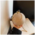 Mini champagne gold spherical evening bag with glitter finish and round metal handle - Gold