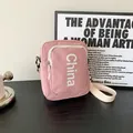 Pink crossbody square bag in nylon with white China lettering and adjustable strap - Pink
