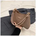 Retro khaki woven shoulder bag with a knotted rope handle and gold metal hardware - Dark Brown