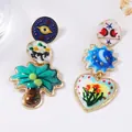 Artistic asymmetrical enamel drop earrings with colorful geometric heart and floral patterns - Asymmetric Artistic Style / Colorful