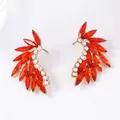 Elegant gold wing earrings with red marquise crystals and round white cubic zirconia stones - Red