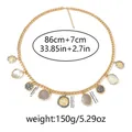 Detail view of gold chunky chain belt with coin charms showing dimensions and weights - Gold