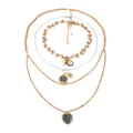 Chic multilayered gold chain necklace with geometric medallions and a heart pendant - Four-Layer Layered Style