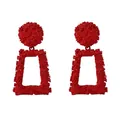 Retro geometric red alloy drop earrings with embossed floral texture on white background - Red
