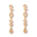 Detail of 2026 drop earrings featuring gold metal alloy and white pearl inlay - Gold Pearl Style
