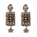 Detailed view of vintage gold-tone floral earrings with intricate rhinestones and amber resin - Amber Rhinestone Style / Gold Rhinestone Style