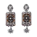 Detail of vintage palace style earrings with amber resin and floral rhinestone patterns - Amber Rhinestone Style / Silver Rhinestone