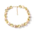 Minimalist beaded necklace with gold metal squares and marble resin cubes on white background - Color Block