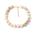 Detail of marble textured resin beads on a necklace with golden adjustable extender chain - Off White