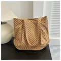 Large yellow tote bag featuring deep blue geometric polka dots and dual shoulder straps - Dark Brown