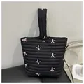 Black quilted puffer handbag with pink bow embroidery and metallic magnetic clasp - Black