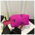 Fuchsiarote gesteppte Kosmetiktasche mit schwarzen Schleifen und Handschlaufe - Fuchsia