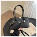 Classic black leather dome bowling bag with gold hardware and adjustable strap - Black