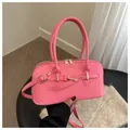Versatile bright pink faux leather bowling bag with gold hardware and top handle - Pink