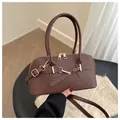 Dark brown faux leather bowling bag with adjustable strap and metallic buckle detail - Dark Brown