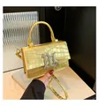 Golden crocodile embossed handbag for women featuring a bold silver metal BL logo buckle - Gold