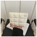 Chic quilted cream cosmetic pouch in soft padded nylon for minimalist makeup storage - White