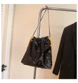 Fashionable black sequin drawstring bucket bag with a stylish metal chain shoulder strap - Black