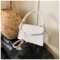 White vintage square shoulder bag with embossed floral pattern and circular handle - White