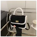 Chic black velvet quilted handbag with white faux fur trim and gold metal closure - Black