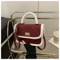 Burgundy quilted handbag with white faux fur trim and gold twist lock closure - Red
