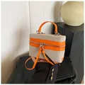 Sac bandoulière bicolore en toile crème et cuir orange avec de longues tirettes de zip - Orange