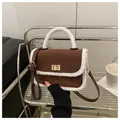 Brown quilted suede handbag with white faux fur trim and elegant gold twist lock detail - Coffee