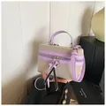 Sac boîte structuré en toile beige et cuir violet avec bandoulière et finitions contrastées - Violet