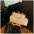 Elegant cream woven evening clutch bag with gold round clasp and chain strap - Off White