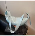 Light blue patent leather shoulder bag with vertical pleats and silver metal eyelets - Blue