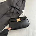 Minimalist black PU leather crossbody square bag featuring a large gold metallic buckle - Black