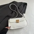 Minimalist white leather crossbody bag featuring a classic gold square metal buckle - White