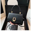 Chic black matte square handbag with gold oval clasp and adjustable crossbody strap - Black