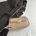 Minimalist beige PU leather shoulder bag with gold square metal buckle and curved base - Khaki