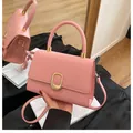 Pink minimalist crossbody square bag with gold oval buckle and top handle design - Pink